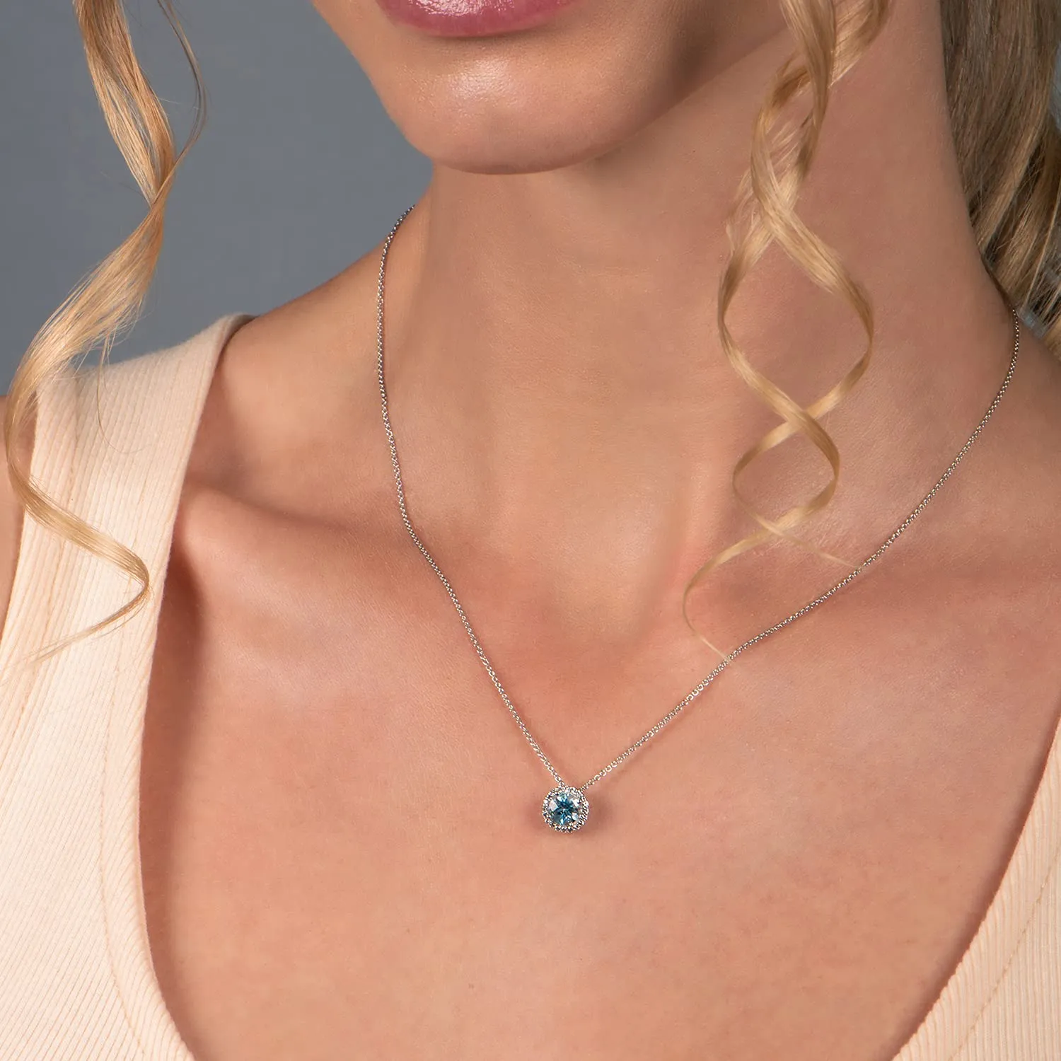 Jewelili Sterling Silver with Round Swiss Blue Topaz and Created White Sapphire Halo Pendant Necklace